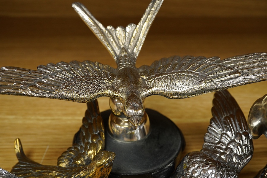 Five chrome plated bird themed car mascots, including three swallows, a partridge and an eagle. Condition - fair.